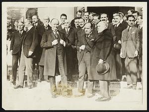 First Meeting of Lausanne Peace Conference. Left to right: Lord Curzon, Premier Benito Mussolini of Italy, and Premier Poincare of France, photographed on the steps of the conference building, following the opening session of the Near East Conference at Lausanne, Switzerland.