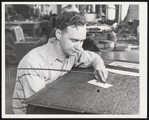 The Map Maker in a Changing World. Corrections in map making plates are made by big-sawing out the area in error and fitting in a corrected patch like Irving Rayfield is doing here. When patch and hole exactly match the new piece is soldered into place.