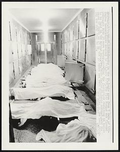 Deaths in the St. Louis area from 5 days of 100-degree temperatures mounted to 113, here 7/14. The City Morgue was flooded overnight with 30 more bodies, crowding the facilities resulting in bodies to be laid in the morgue hall. Mrs. Helen Taylor, St. Louis coroner, said the cause of death in 21 of the 30 cases had been attributed to the heat, bringing the city toll to 75.