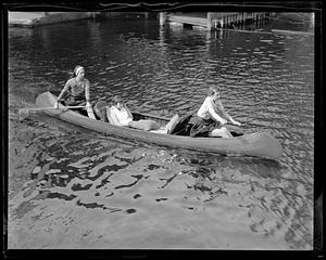 Three people in a canoe