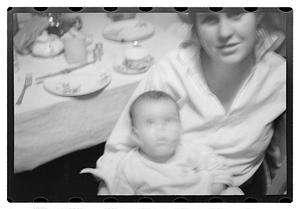 Maude Sanromá holding a baby on her lap