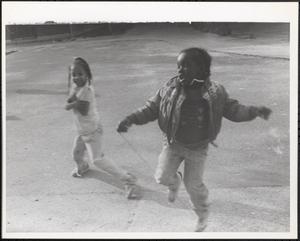 Two girls playing outside
