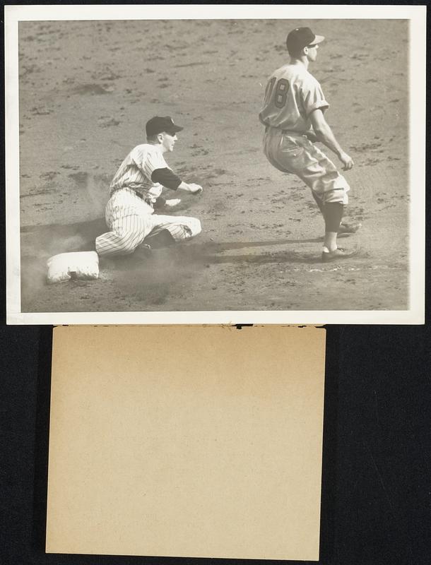 Ruppert Blitzkrieg Rolls on Yankee First Baseman Babe Dahlgren slides safely into third base in the third inning of the second World Series Games in New York, Oct. 5, when Pitcher Monte Pearson's sacrifice bunt advanced him from second. The Bronx Bombers rolled over the Reds from the Rhineland 4-0, giving them two straight wins. Pearson allowed the National League champions only two hits.