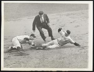 Justifiable larceny -- Second baseman Joe Gordon tried vainly to reach Ival Goodman of the Reds, who made good his steal to second base, paving the way for the first Reds score in the World Series. Bill Dickey made the throw; there was no error. This was in fourth inning