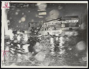 Cars Plow Through Water On Flooded Southampton St., Roxbury.