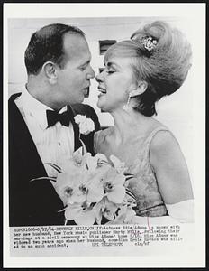 Actress Edie Adams is shown with her new husband, New York music publisher Marty Mills, following their marriage at a civil ceremony at Miss Adams' home 8/16. Miss Adams was widowed two years ago when her husband, comedian Ernie Kovacs was killed in an auto accident.