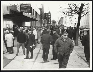 Boston Gas workers leave John Hancock Hall after breaking up meeting without taking vote to ratify new contract. Meeting was adjourned until 1 PM Dec 30.