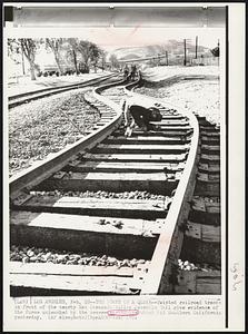 The Power of a Quake -- Twisted railroad tracks in front of the nearby San Fernando Valley Juvenile Hall give evidence of the force unleashed by the severe earthquake which hit Southern California yesterday.