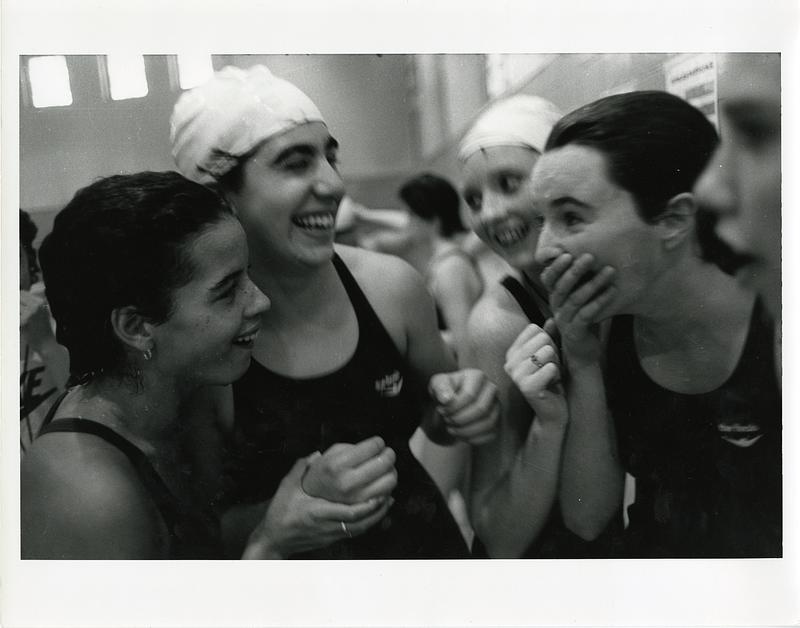 Five high school swimmers laughing