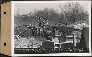 Contract No. 70, WPA Sewer Construction, Rutland, looking southeasterly at measuring Sta. B on Rutland-Holden sewer from manhole 1-B, Rutland Sewer Line, Rutland, Mass., May 9, 1940