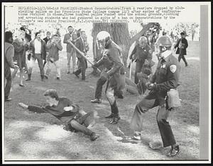 Student demonstrators (front & rear) are dropped by club-wielding police on San Francisco State College campus 12/3 after series of confrontations resulted in chaos. Three hundred police rushed onto the school grounds, clubbing and arresting students who had gathered in spite of a ban on demonstrations by the College's new Acting President, S.I. Hayakawa