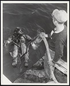 Explorer of the Deep Army Diver M/SGT. Melvin Alderman is raised to the surface after exploring the waters at Inchon Harbor, Korea.