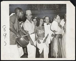 Rio Makes Merry at Mardi Gras. Citizens of Brazil's capital forgot the war and its worries for a time last week in the celebration of Carnaval (correct), annual South American Mardi Gras. Pictured here are some of the opening night festivities at the Casino de Urca, largest of Rio's casinos.