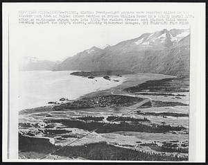 Twenty-eight persons were reported killed in the Alaskan port town of Valdez (shown nestled on Prince William Sound in a 6/1/35 photo) 3/28, after an earthquake struck here late 3/27. The violent tremors sent 10-foot tidal waves smashing against the city's shores, causing widespread damages.