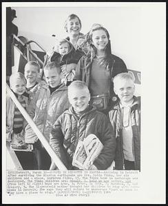 Spared by Disaster in Alaska -- Arriving in Detroit after surviving the Alaskan earthquake are Mrs. Rubin Tikka, her six children and a niece, Gretchen Sipes, 15. The Tikka home in Anchorage was destroyed. The Tikka children are: Danali, 1, held bij her mother, and (from left to right) boys are Arne, 3; Peter, 5; Erik, 7; Matthew, 8; and Gregory, 9. The 31-year-old mother brought her children to stay with relatives in Detroit. She says they will return to Anchorage "just as soon as they have a place to stay."