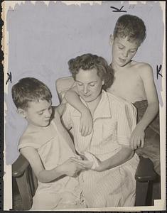 Robert, 7 (left) & Richard, 9 - with their mother Mrs. Helen Daigneau - boys look at mother's hand, slashed by "lone wolf" slasher