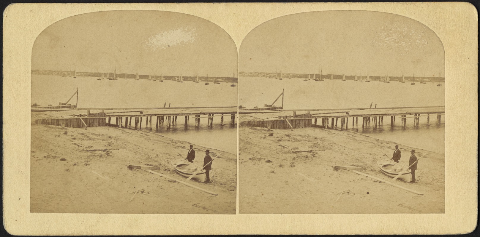 Men on beach with rowboat