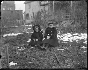 Two girls with sleds