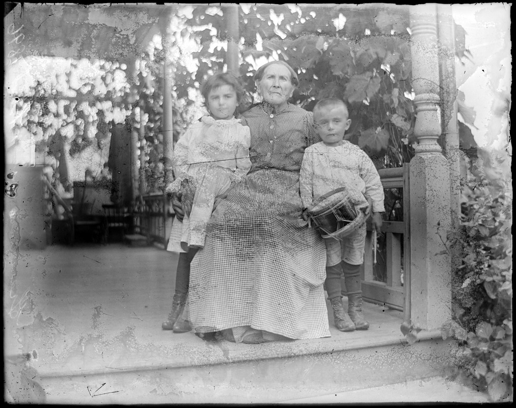Erna and Fredrick Wilhelm on the front porch with their maternal grandmother, Fredricka Greunert