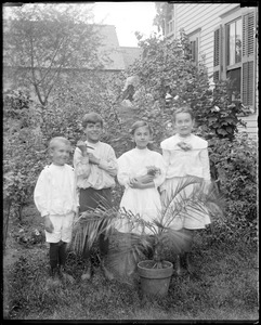 Four children in a garden