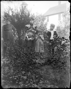 Four children in a garden