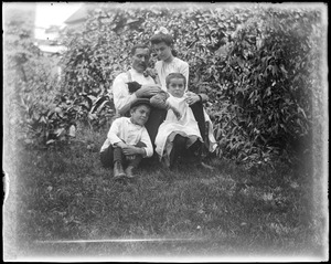 C.R. Wilhelm and three children in yard
