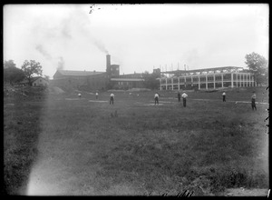 Men playing baseball in a field near Germania Mills