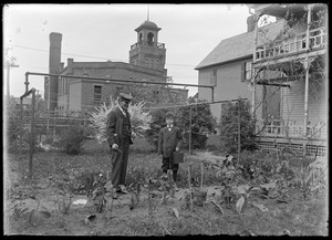C.R. Wilhelm and his son Robert in their back yard