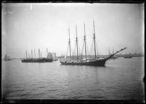Four-masted ships in a harbor