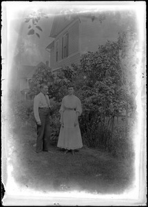 C.R. Wilhelm and his daughter Erna Wilhelm in their backyard