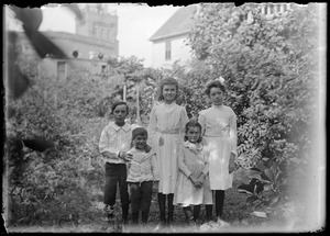 Four Wilhelm children and a friend in the Wilhelm's back yard