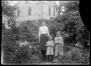 Erna and Mabel Wilhelm with another girl in their back yard