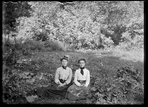 Julia and Annie Voss seated on the grass