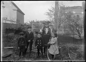 Four Wilhelm children and a boy in the Wilhelm's back yard
