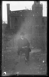 Man sitting in a yard