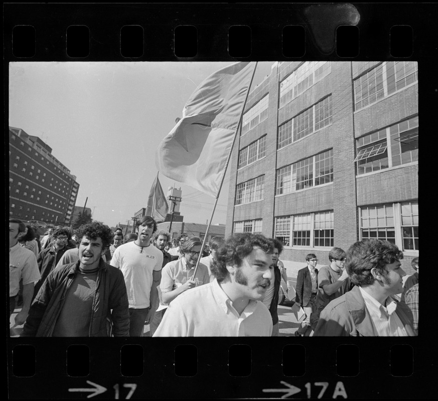 Chanting SDS members, armed with Viet Cong flags, approach main ...