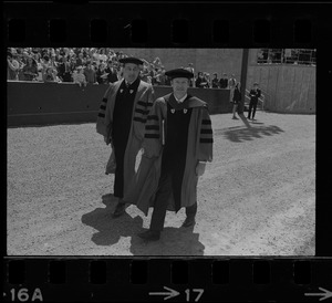 New Boston University president John Silber (right) and chairman of the Board, Hans Estin (left), in graduation exercises at Nickerson Field