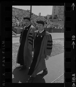 New Boston University president John Silber (right) and chairman of the Board, Hans Estin (left), in graduation exercises at Nickerson Field