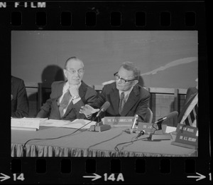 Dr. Paul Samuelson (right) addresses symposium at the B.U. Medical Center while Dr. Irving Page (left) listens