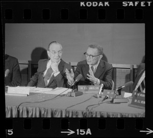 Dr. Paul Samuelson (right) addresses symposium at the B.U. Medical Center while Dr. Irving Page (left) listens