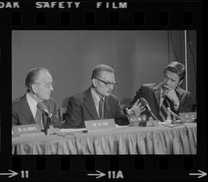 Dr. Paul Samuelson (center) addresses symposium at the B.U. Medical Center while Dr. Irvine Page (left) and J.R. Silber, Pres. of B.U. (right) listen
