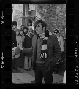 A student standing outside Ford Hall at Brandeis University during Black student protest