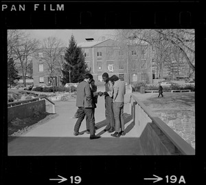 Brandeis University student protester, Reggie Sapp, center, seen in front of Ford Hall and speaking with a group of students during sit-in