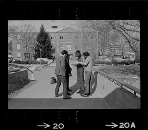 Brandeis University student protester, Reggie Sapp, center, seen in front of Ford Hall and speaking with a group of students during sit-in