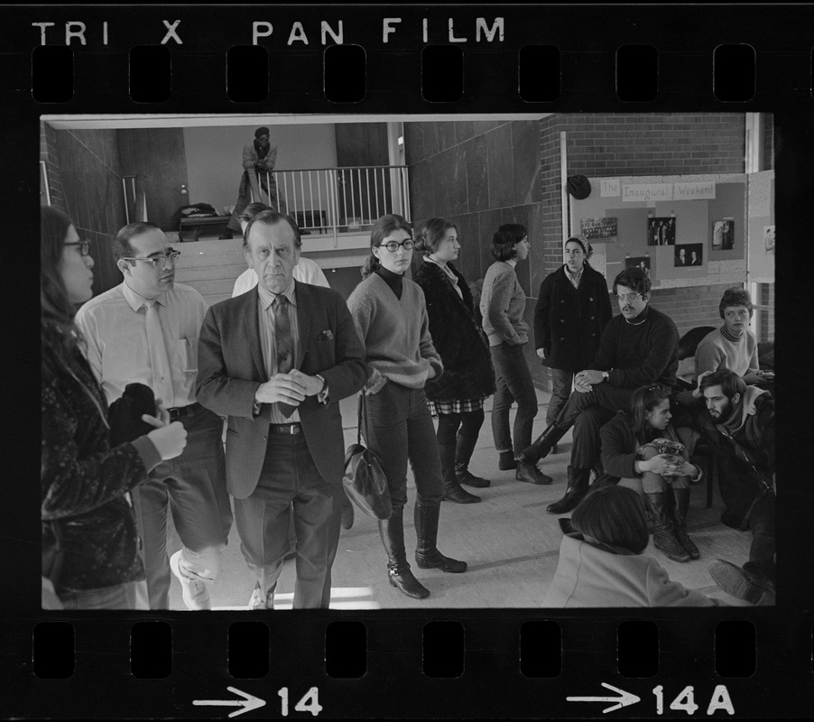 Clarence Berger, executive vice president (right), and Jeff Osoff (left), spokesman, both of Brandeis University, surrounded by students in Bernstein-Marcus Administration Center during sit-in