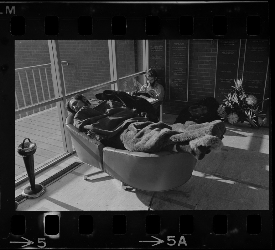 Student sympathizer seen asleep inside Brandeis University administration building during sit-in