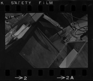 Partial view of a desk and electrical cords