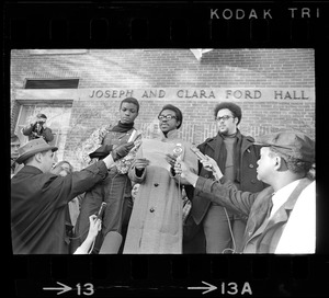 Reggie Sapp, Lloyd Daniels and Randall Bailey read the Ford Hall protesters' demands outside of Ford Hall during Brandeis University sit-in