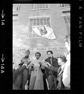 Reggie Sapp, Lloyd Daniels and Randall Bailey read the Ford Hall protesters' demands outside of Ford Hall during Brandeis University sit-in