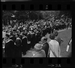 Faculty procession along a path during Brandeis University commencement